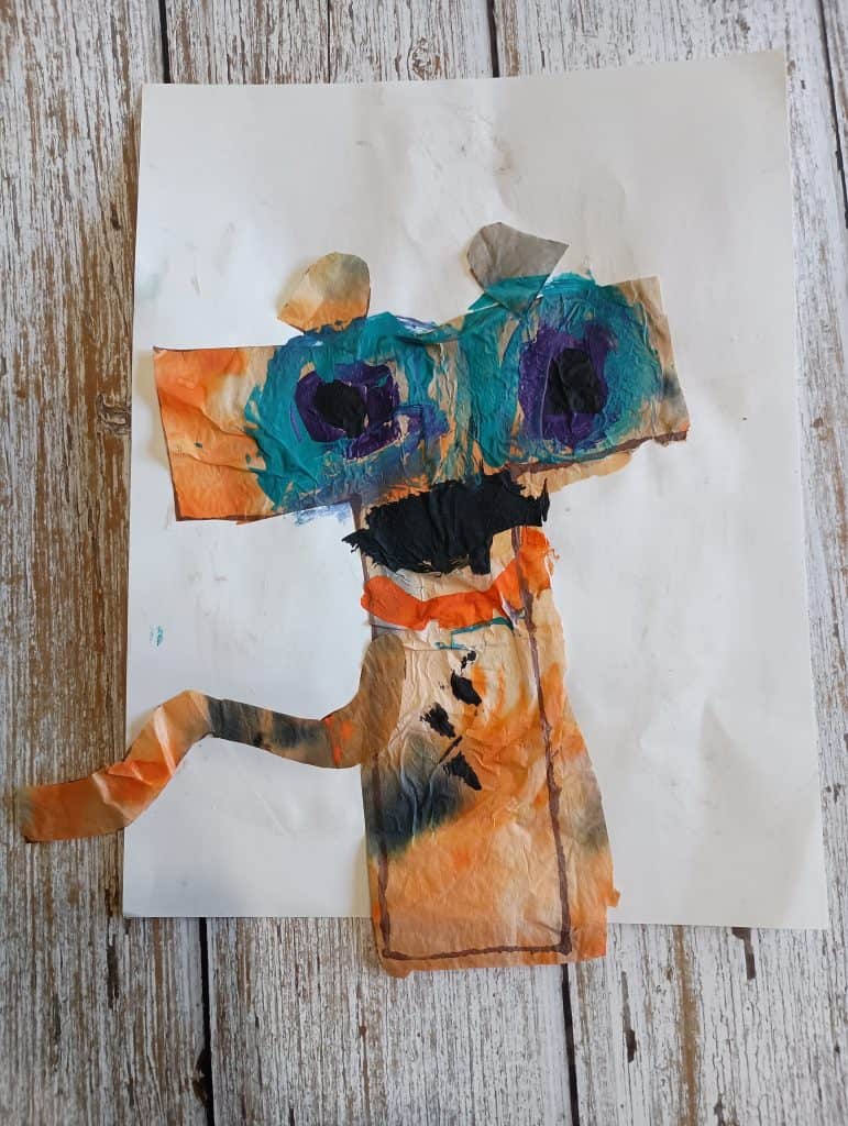 Picture of a T is for tiger craft made from tie dyed tissue paper and tempera paint by a preschooler