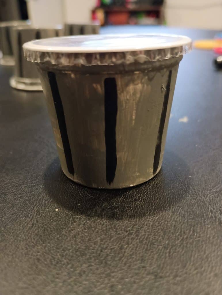 Picture of a Play Doh favor painted like a trash can with no lid