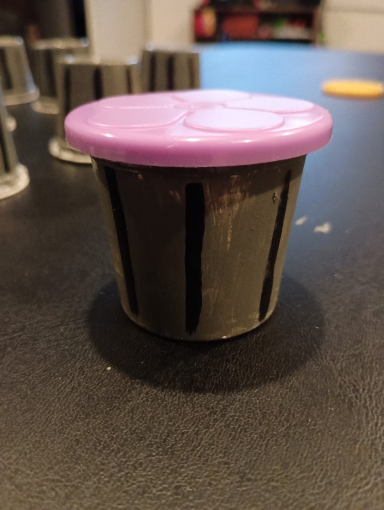 Picture of a Play Doh favor painted like a trash can with a lid