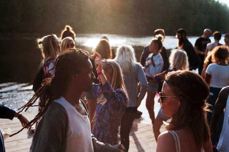 millennials on boat dock partying