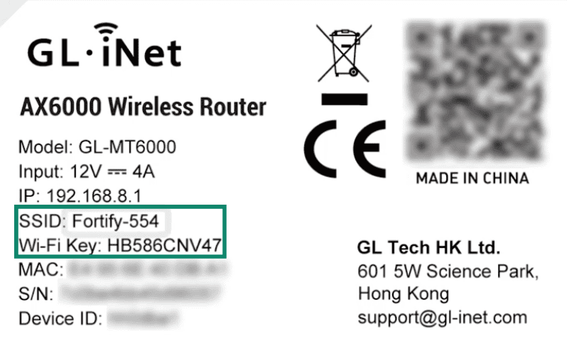 Label on a GL.iNet Fortify router with the SSID and Wi-Fi Key highlighted on the left