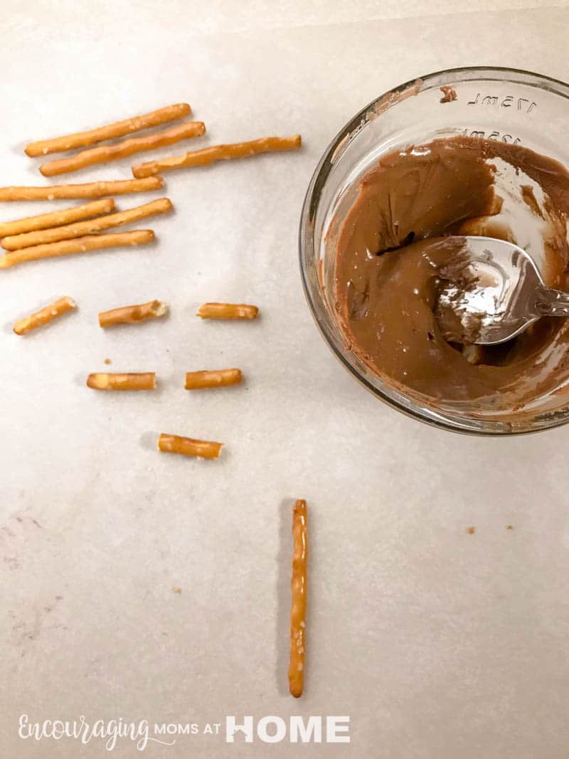 pretzels and melted chocolate for making crosses