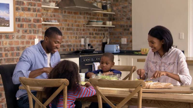 A young family enjoying a meal together