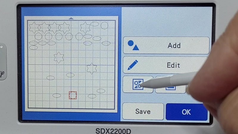 Icon to select to use the automatic placement of multiple shapes on your Scan N Cut to maximize the cutting space of your materials.