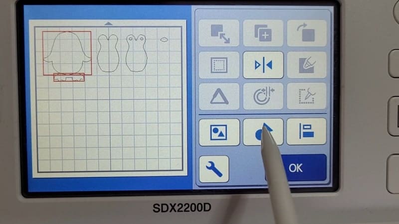 The Scan N Cut inbuilt-designs can be modified. This picture shows welding the penguin feet to the main body.