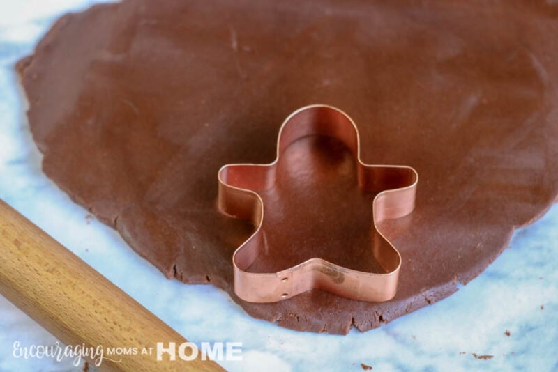 cutting out the dough with a cookie cutter for Chewbacca cookies.