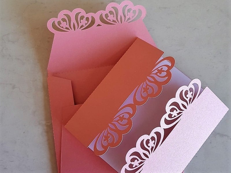 Pink edged laser cut wedding invitations