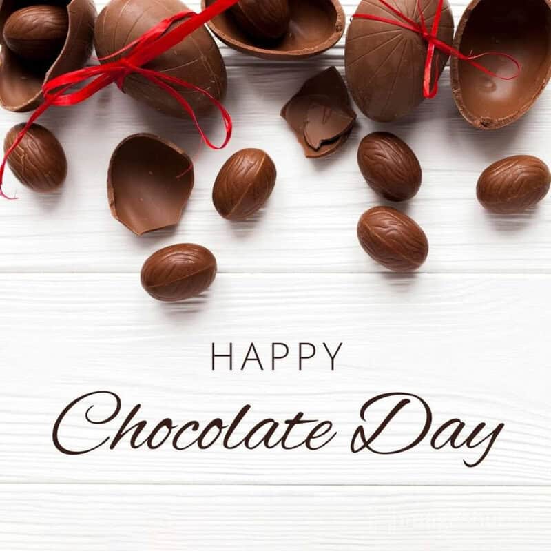 yummy chocolate balls with happy chocolate wishes on banner