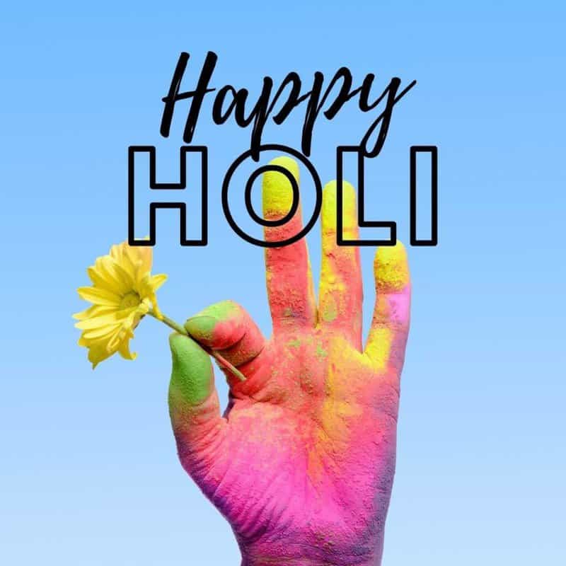 happy holi with yellow flower and colors