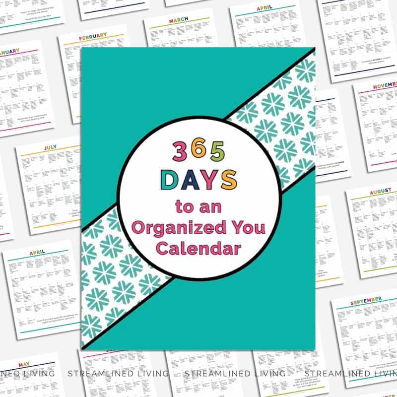 365 Days to an Organized Your Organizing Calendar pages splayed out on an angle with teal cover on top against white background