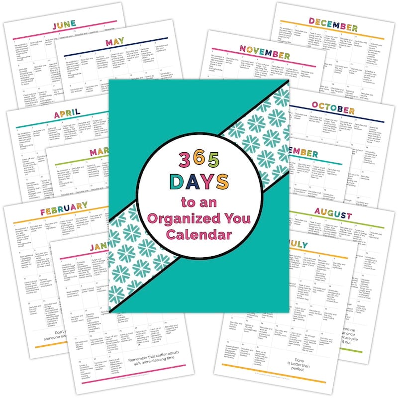 365 Days to an Organized Your Organizing Calendar pages splayed out on an angle with teal cover on top against white background