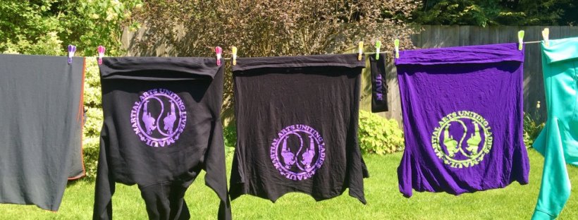 MAUL-branded kit hanging on a washing line in a member's garden