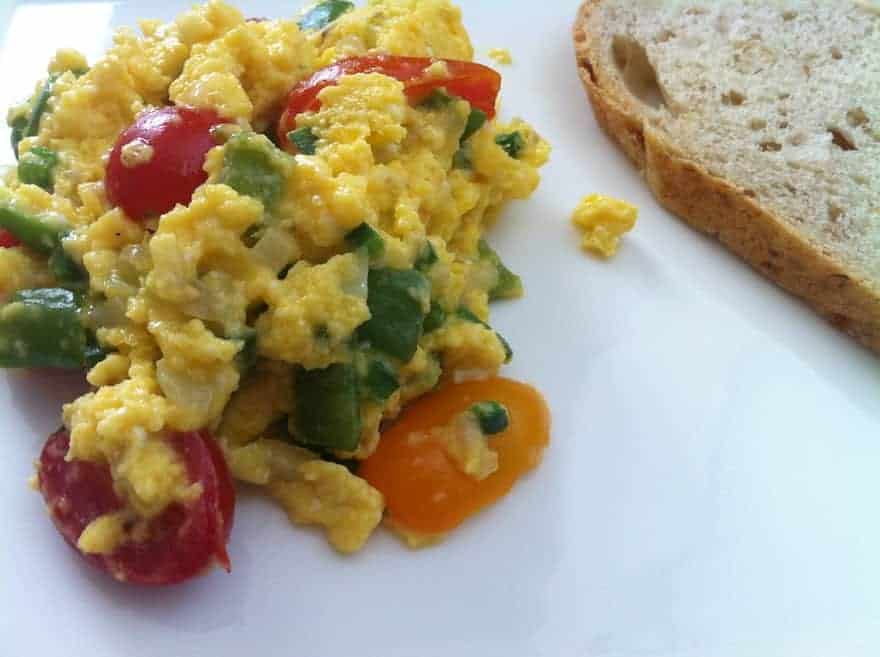Scrambled eggs with tomatoes and vegetables mixed in