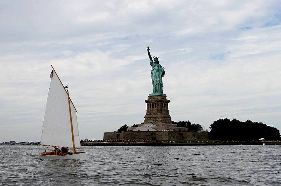 Goat Island Skiff self build sailboat and statue of liberty - plywood and epoxy