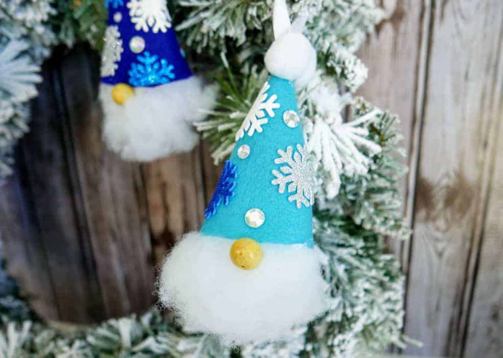 Christmas gnome ornament hanging from a wreath