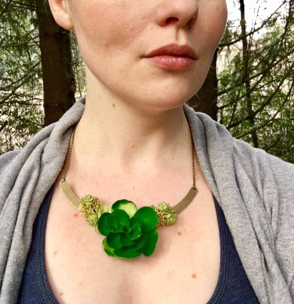 succulent necklace on woman's neck