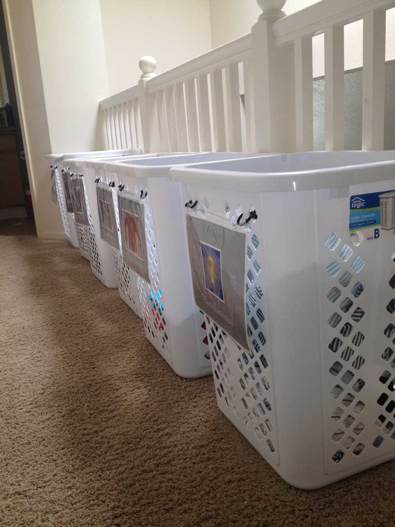 Hallway full of laundry baskets shows an example of the best laundry system ever.