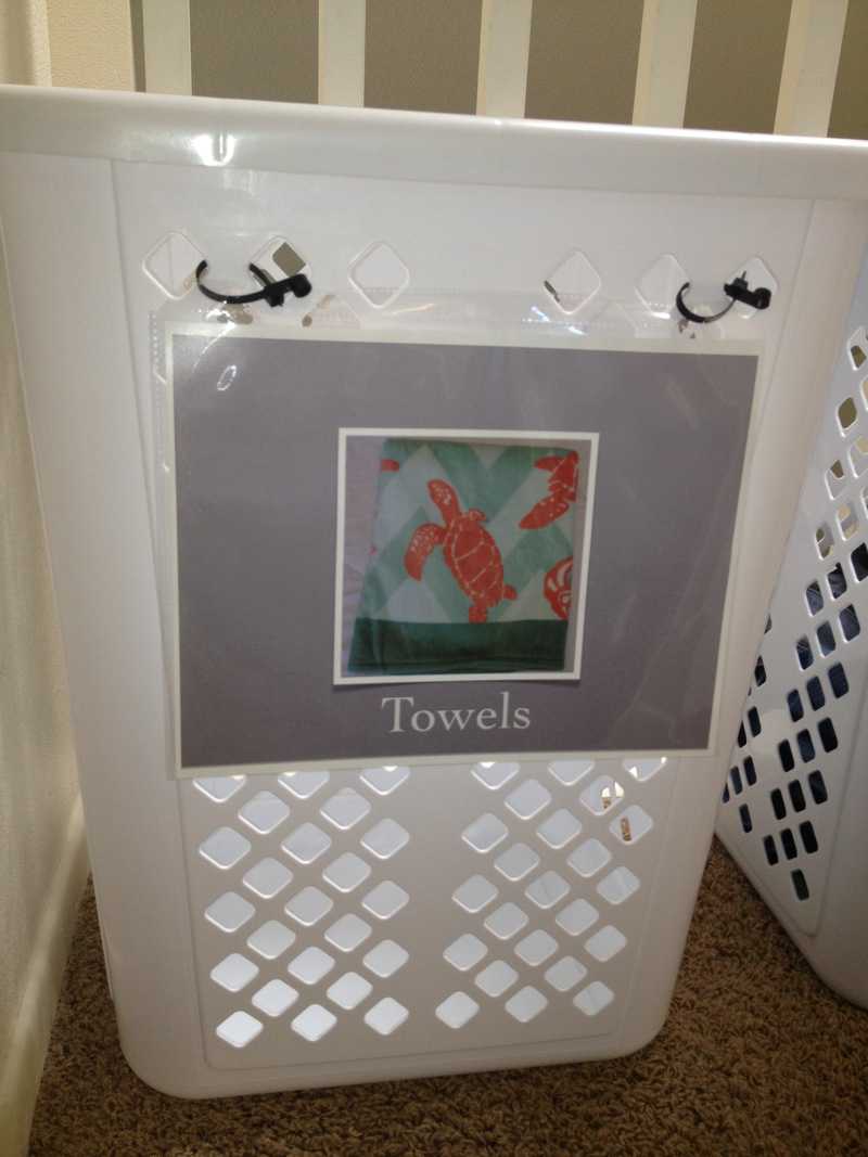 Sign on Laundry Basket reads "Towels" and shows a picture of a towel.