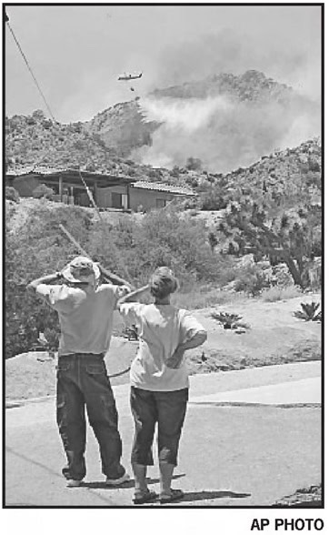 Pioneertown residents watching fire fighting helicopter