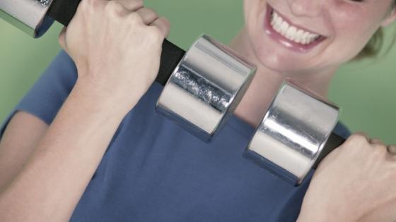 woman lifting weightsdemonstrating bone strengthening activities you can do at home