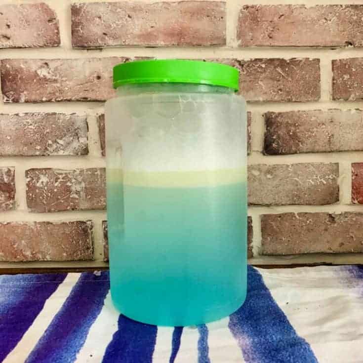 jar of homemade mole repellent on a table
