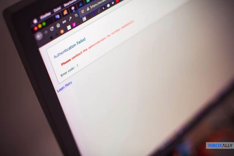 A computer monitor displays an "Authentication Failed" error message with instructions to contact the administrator and error code -1, indicating a possible SPF Permerror that could impact email deliverability.