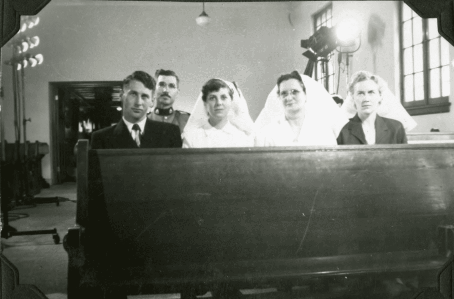 Staff in chapel during filming of a movie. 1952. Shingwauk Residential Schools Centre, Algoma University.
