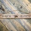Reclaimed driftwood mountain sign with latitude longitude