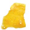 Skywalker OG Shatter showing glossy, amber-coloured cannabis extract