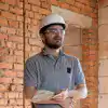 an-electrician-contractor-examines-a-blueprint-at.webp