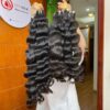Close up showing the bouncy texture of our raw Vietnamese wavy hair