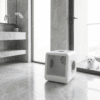 Smart white pet dryer box in a luxury marble bathroom — Petsy high-end pet grooming technology