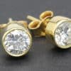 Gold and diamond stud earrings, perfect for special occasions or everyday elegance.