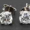 Diamond stud earrings in silver settings for women.