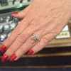 Close-up of a diamond ring on a woman's finger at Weldons Jewellers.