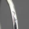 Elegant Cartier diamond ring with signature hallmark.