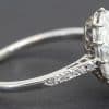 Stunning diamond ring with a large central stone and pavé band, perfect for special occasions.