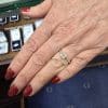 Diamond engagement ring on a woman's finger at Weldons Jewellers.