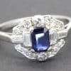 Stunning sapphire and diamond engagement ring with intricate design.