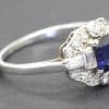 Silver ring with a central blue sapphire and surrounding diamonds, fine jewelry from Weldons Jewelle.