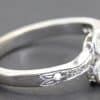 Silver diamond ring with floral design, perfect for engagement jewelry.