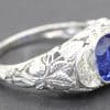 Silver ring with a central blue sapphire and surrounding diamonds, fine jewelry from Weldons Jewelle.
