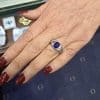 Elegant sapphire ring on a woman's hand at Weldons Jewellers.