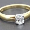 Gold engagement ring with a sparkling cushion-cut diamond.