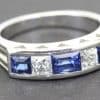 Elegant sapphire and diamond ring with a silver band, perfect for special occasions.