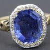 Blue sapphire gemstone ring with diamond accents.