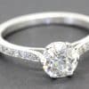 Stunning diamond solitaire ring with pavé band from Weldons Jewellers.