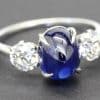 Elegant blue sapphire and diamond ring with a silver band, perfect for special occasions.