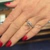 Beautiful diamond engagement ring on a woman's finger.