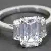 Elegant emerald cut diamond ring in silver band, perfect for special occasions.